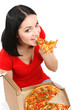 Beautiful girl eats pizza isolated on white
