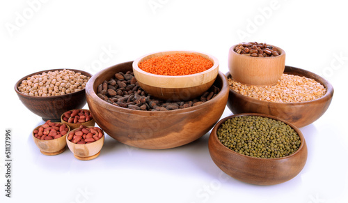Photo: Different kinds of beans in bowls isolated on white Different kinds of beans in bowls isolated on white
