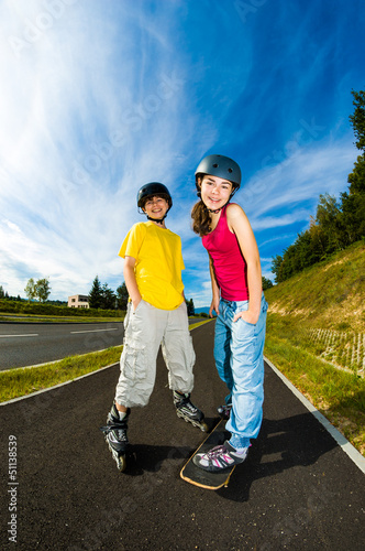 Photo: Active young people - rollerblading, skateboarding Active young people - rollerblading, skateboarding
