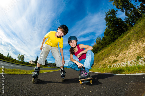 Photo: Active young people - rollerblading, skateboarding Active young people - rollerblading, skateboarding