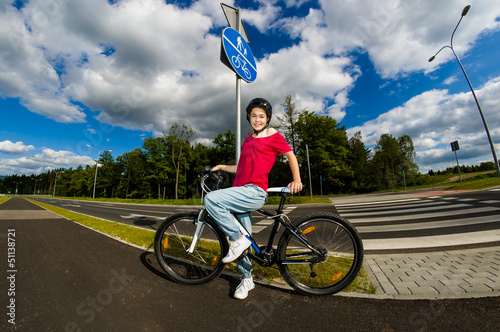Photo: Healthy lifestyle - girl biking Healthy lifestyle - girl biking