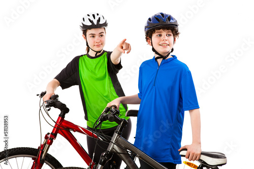 Photo: Cyclists - boy and girl isolated on white background Cyclists - boy and girl isolated on white background
