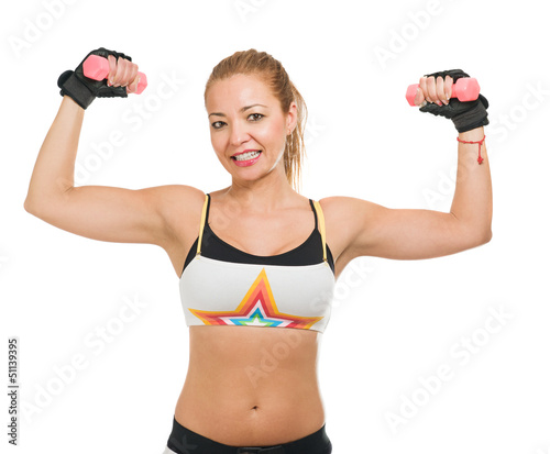 Photo: Mid-adult Woman Lifting Dumbbell Mid-adult Woman Lifting Dumbbell