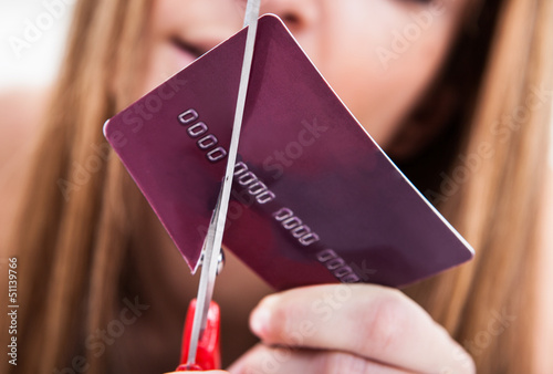 Photo: Close-up Of Hand Cutting Credit Card Close-up Of Hand Cutting Credit Card