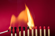 Burning match setting fire to its neighbors