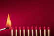 Burning match setting fire to its neighbors