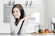 Woman in a white kitchen
