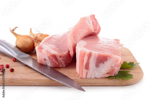 Photo: isolated raw meat on board isolated raw meat on board