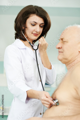 Photo: Doctor listening heartbeat Doctor listening heartbeat