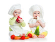 babies boy and girl wearing a chef hat with healthy  food vegeta