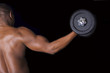 Photo: Muscular young man lifting weights Muscular young man lifting weights