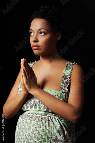 Photo: Young afro american pregnant woman praying Young afro american pregnant woman praying