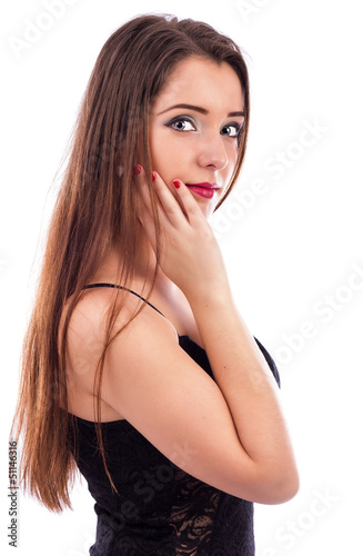 Photo: Beautiful woman with long brown hair holding hand on face Beautiful woman with long brown hair holding hand on face