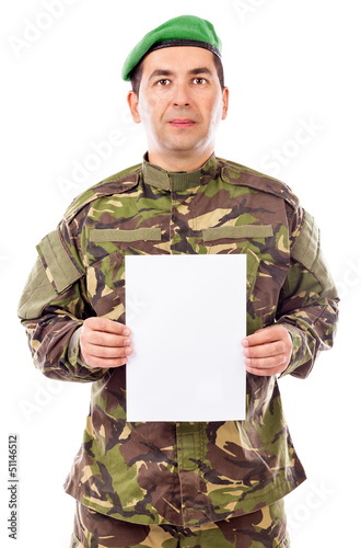 Photo: Young soldier holding white sheet of paper Young soldier holding white sheet of paper