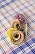 Rolls of herring fillets with lemon and onion