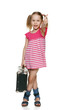 Little girl with old fashioned suitcase showing thumb up