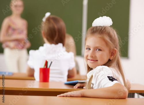 Photo: Little girl at school class Little girl at school class