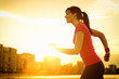 Woman running on summer sunset
