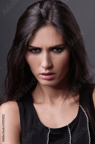 Photo: portrait of a beautiful young woman portrait of a beautiful young woman