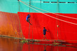 Workers are repairing cargo ship.