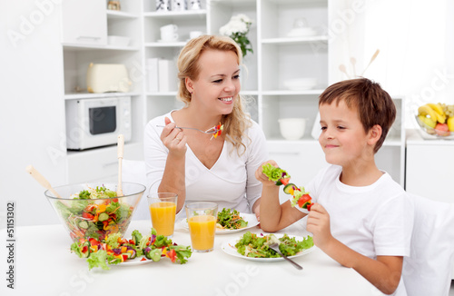 Photo: Woman and little boy having a healthy snack Woman and little boy having a healthy snack