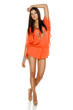 Fashion woman poising in light summer dress in full length