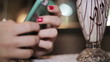 The girl in the cafe with a phone in hand
