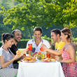 Photo: Multiethnic friends sharing an enjoyable meal Multiethnic friends sharing an enjoyable meal