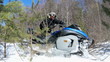 Man on snowmobile in winter