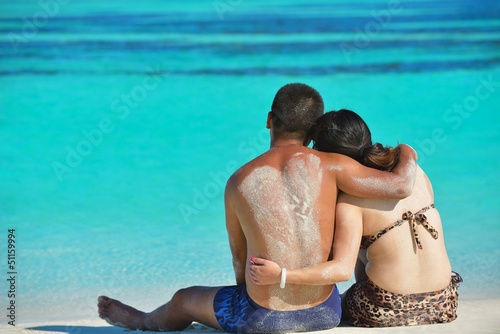 Photo: happy young couple enjoying summer on beach happy young couple enjoying summer on beach