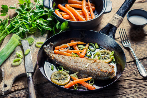Photo: Freshly fried fish with lemon and parsley Freshly fried fish with lemon and parsley