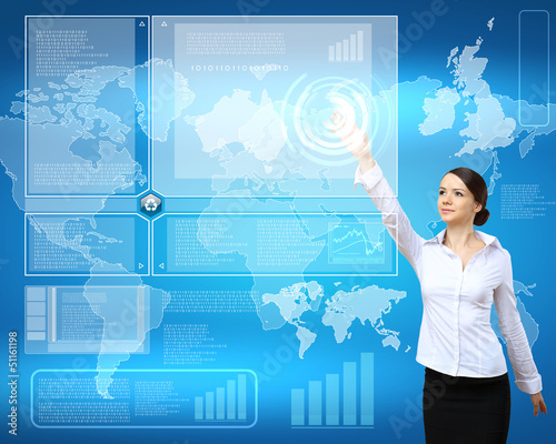 Photo: Businesswoman and technology related background Businesswoman and technology related background