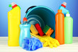 Cleaning items in bucket on  color background