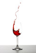 Red wine splash over white background