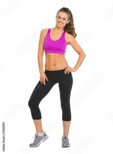 Photo: Full length portrait of smiling fitness young woman Full length portrait of smiling fitness young woman