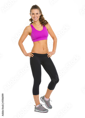 Photo: Full length portrait of happy fitness young woman Full length portrait of happy fitness young woman