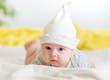 infant baby boy lying on stomach