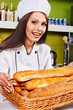 Female chef holding  food.