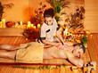 Woman getting bamboo massage.