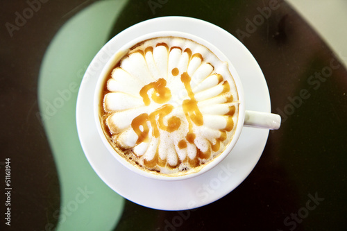 Photo: Cappuccino or latte coffee in cup Cappuccino or latte coffee in cup