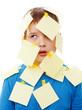 boy with memo posts on his face