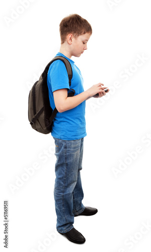 Photo: boy send text message with mobile phone boy send text message with mobile phone