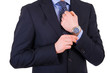 Businessman checking time on his wristwatch.