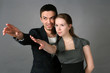 Portrait of  young couple looking in one direction