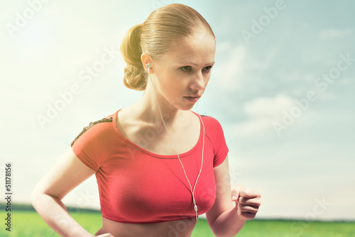 Photo: Young woman running outdoors Young woman running outdoors