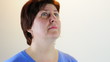 Studio portrait of a matured Caucasian woman looking up