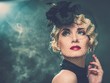 Elegant blond retro woman  wearing little hat 