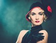 Elegant blond retro woman  wearing little hat 