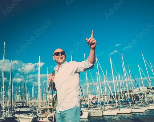 Photo: Happy middle-aged man with backpack Happy middle-aged man with backpack