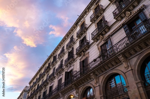 Photo: Building facade with balconies against beautiful sky Building facade with balconies against beautiful sky